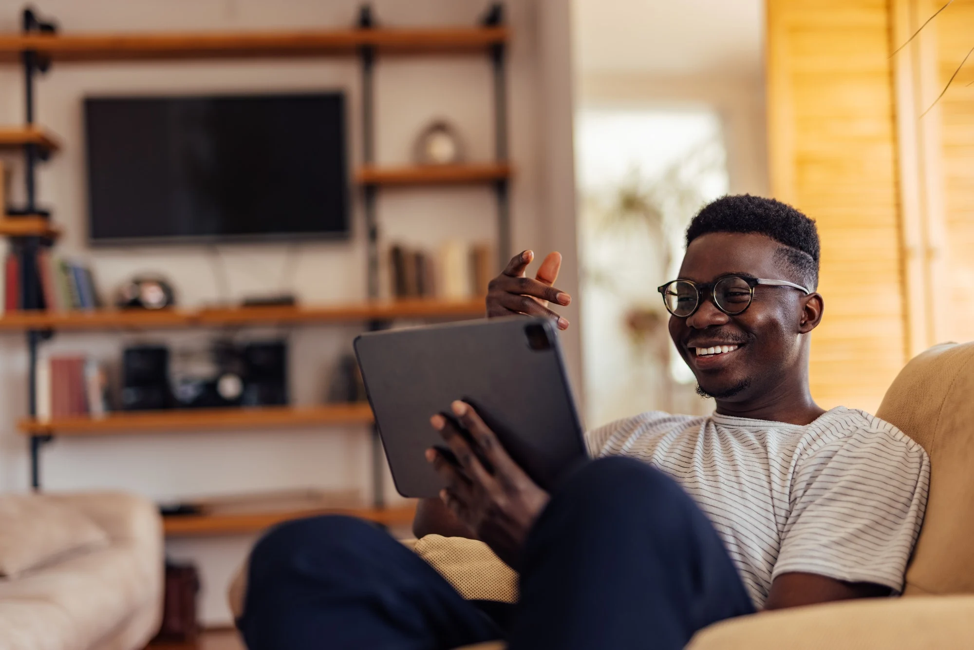 Exploring Knowledge: An adult man searches online for his favorite books, seeking wisdom and insights to enhance optimal human performance.